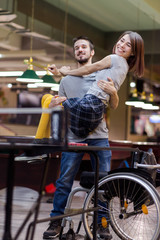 Fototapeta na wymiar Beautiful disabled girl and her boyfriend celebrating game victory