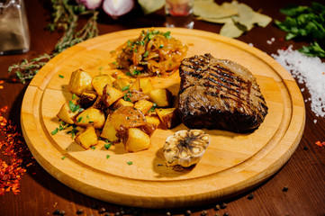 fried potatoes on a plate on a wooden table
