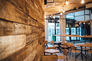 View on wooden wall and coffee shop in blurred background