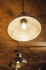 Large vintage lamp hanging from ceiling, modern interior