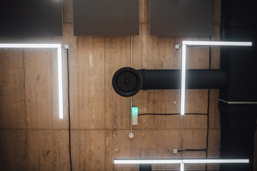 View on modern led lightning hanging from ceilings, industrial building concrete texture