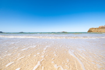 Fototapeta na wymiar Large sandy beach in the town of 
