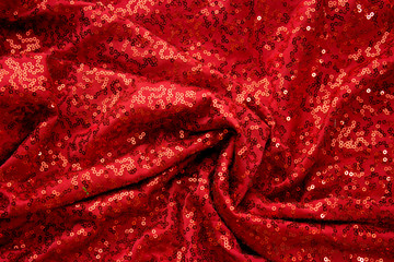 red fabric with sequins texture background