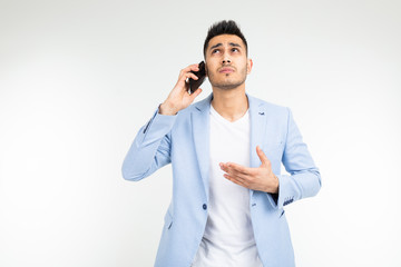 man in a blue jacket holds a phone with poor mobile connection on a white background