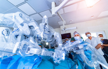 Surgical room in hospital with robotic technology equipment. Minimally invasive surgical...