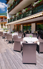 Street restaurant with tables and chairs at Bad Kleinkirchheim Austria