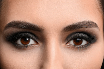 Young woman with beautiful makeup, closeup