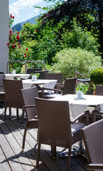 Street restaurant with tables and chairs at Bad Kleinkirchheim in Austria