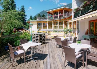Fototapeta na wymiar Street restaurant and tables and chairs in Bad Kleinkirchheim Austria