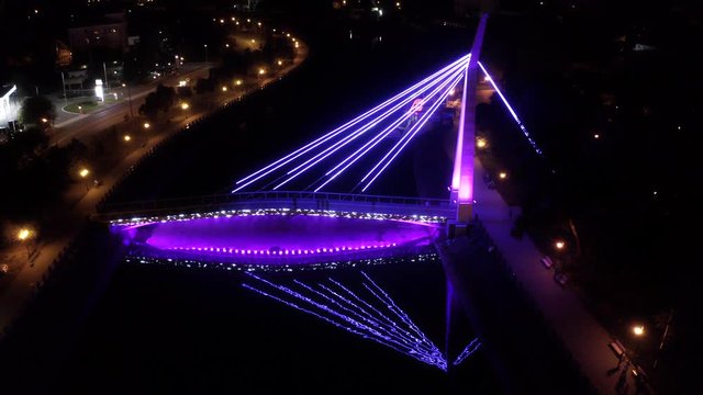 Ukraine, Kharkov, March 4, 2020, Strelka Park, Suspension foot bridge, aerial survey 4k