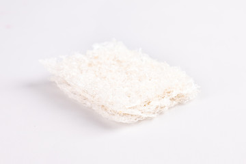 The snow-white bird's nest is a popular food，Dried swiftlet nests ready for cooking on white background.