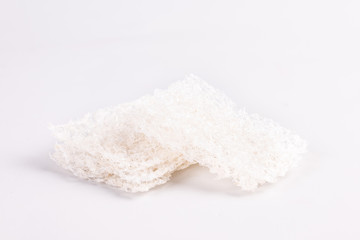 The snow-white bird's nest is a popular food，Dried swiftlet nests ready for cooking on white background.