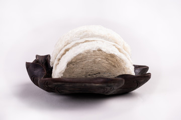 The snow-white bird's nest is a popular food，Dried swiftlet nests ready for cooking on white background.