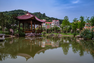 There is a pavilion on the misty Lake