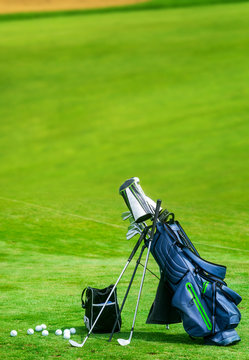 Bag of golf clubs on the golf course vertical copy space