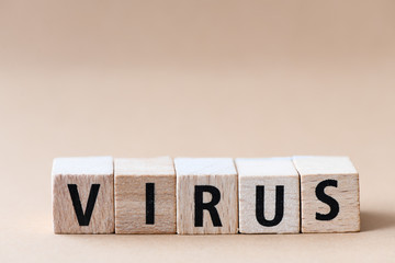 Virus text from wooden letters on a light background