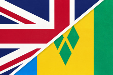 United Kingdom vs Saint Vincent and the Grenadines national flag from textile. Relationship between two countries.