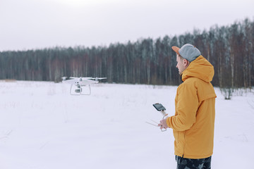 Young male tourist Using drone photographs and shoots nature