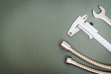 Set of tool and hoses on dark background prepared by professional master before repair or...
