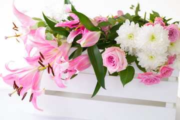 Bouquet of pink and white flowers isolated against a white background.