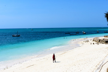 White beach and deep blue sea at the West coast of Sansibar