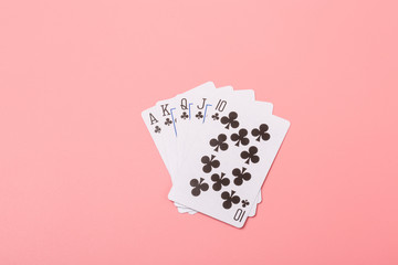 Expanded playing cards on pink background