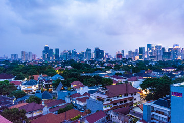 Jakarta, Indonesia - 8th June 2019: Central Jakarta cityscape at sunset. Jakarta Central Business District. Aerial view of Menteng, Central Jakarta.