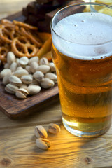 beer and snacks on a light background
