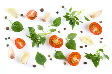 Basil, tomatoes, garlic on a white background