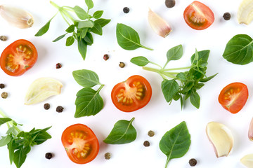 Basil, tomatoes, garlic on a white background