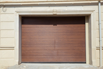 Shutter door or roller door and concrete floor outside .White Automatic shutters in a house . gates in the garage . Automatic Electric Roll-up Gate Or Push-up Door In The Modern Building .