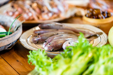 There are fish and other fresh sea ingredients in the kitchen