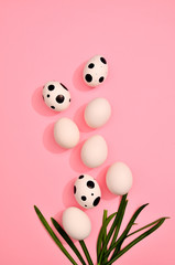 Many hand drawn easter White eggs pattern on trendy pink pastel color background. Spring and Easter holiday concept with copy space.