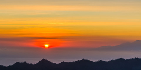 Fototapeta na wymiar Sunrise panorama view from top of Batur volcano