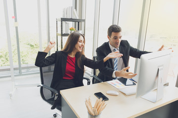 Successful business man and woman are happy.