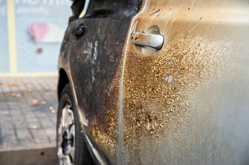 Closeup of the car burnt down on the city car park