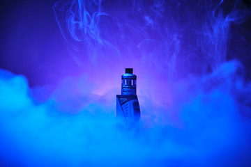 electronic cigarette vape on a blue background on steam cloud..