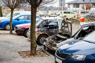 Closeup of the car burnt down on the city car park