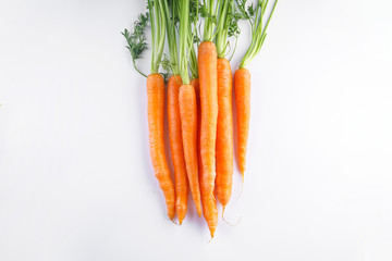 Flat lay composition with ripe fresh carrots on white background