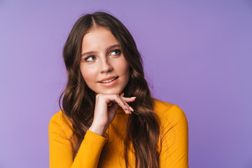 Image of young beautiful woman smiling and looking at copyspace