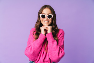 Image of young beautiful woman wearing sunglasses smiling at camera