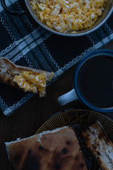 scrambled egg at breakfast with a cup of tea