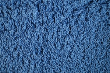 blue background of a fabric Terry towel Mat