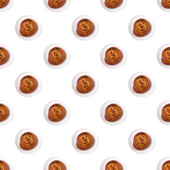 Seamless pattern made of buns with raisin on white background