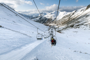 Fototapeta na wymiar Chairlifts on ski slopes.