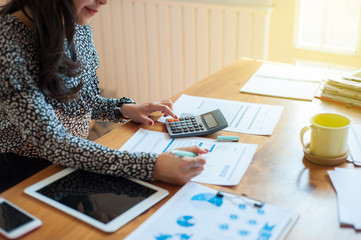 Women are calculating about her expenses and liabilities.