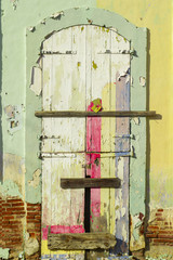 old abandoned  wooden wall peeling texture and corroded padlock