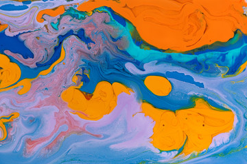 Fototapeta na wymiar Blue and orange marbling liquid background. Fluid art abstract texture. Mixed acrylic inks.