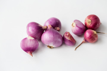 Fresh shallots-red onions on the white background