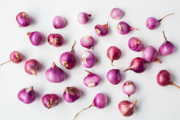 Fresh shallots-red onions on the white background